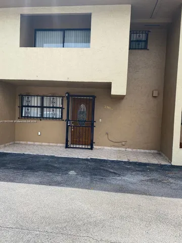 a view of wooden floor and entryway