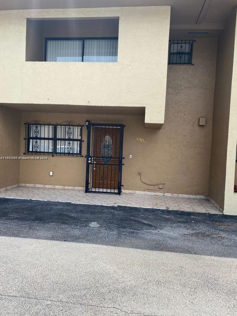 5306 West 26th Avenue, Unit 102 Hialeah, FL 33016 - Photo 1 of 33 a view of wooden floor and entryway