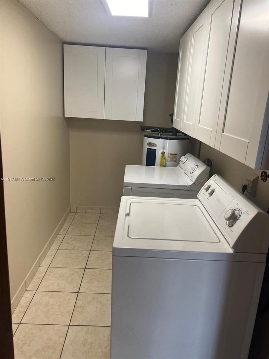 5306 West 26th Avenue, Unit 102 Hialeah, FL 33016 - Photo 13 of 33 a utility room with dryer and washer