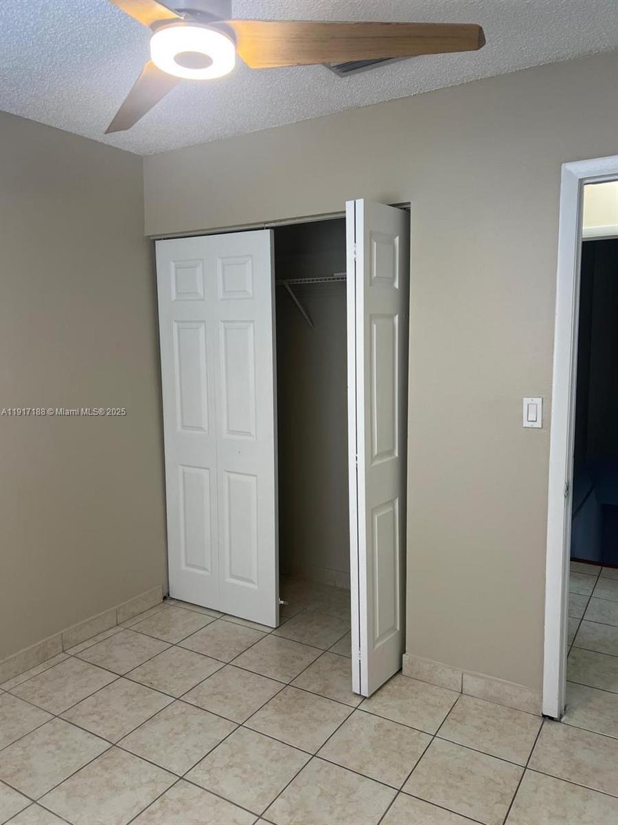 5306 West 26th Avenue, Unit 102 Hialeah, FL 33016 - Photo 25 of 33 an empty room with windows