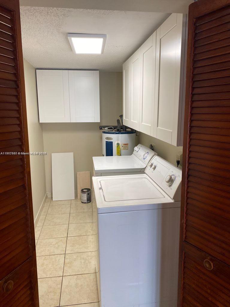 5306 West 26th Avenue, Unit 102 Hialeah, FL 33016 - Photo 27 of 33 a utility room with washer and dryer