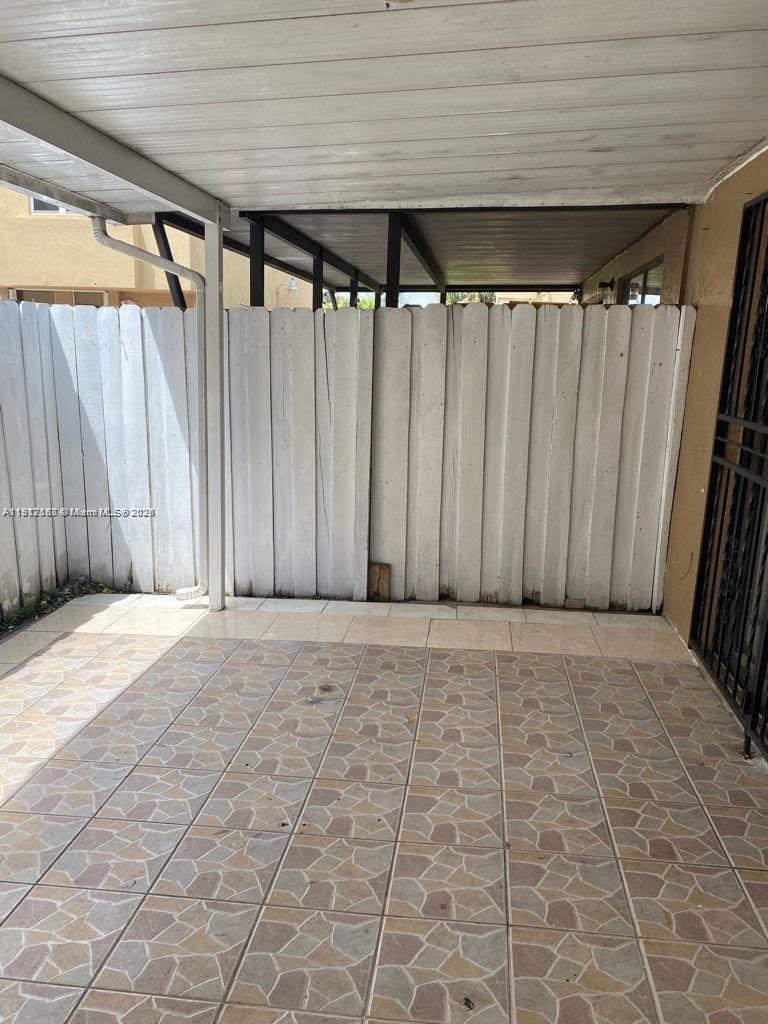 5306 West 26th Avenue, Unit 102 Hialeah, FL 33016 - Photo 28 of 33 a view of outdoor space with wooden walls