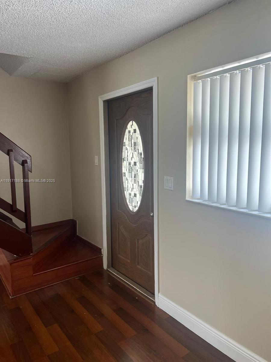 5306 West 26th Avenue, Unit 102 Hialeah, FL 33016 - Photo 3 of 33 a view of entryway with wooden floor