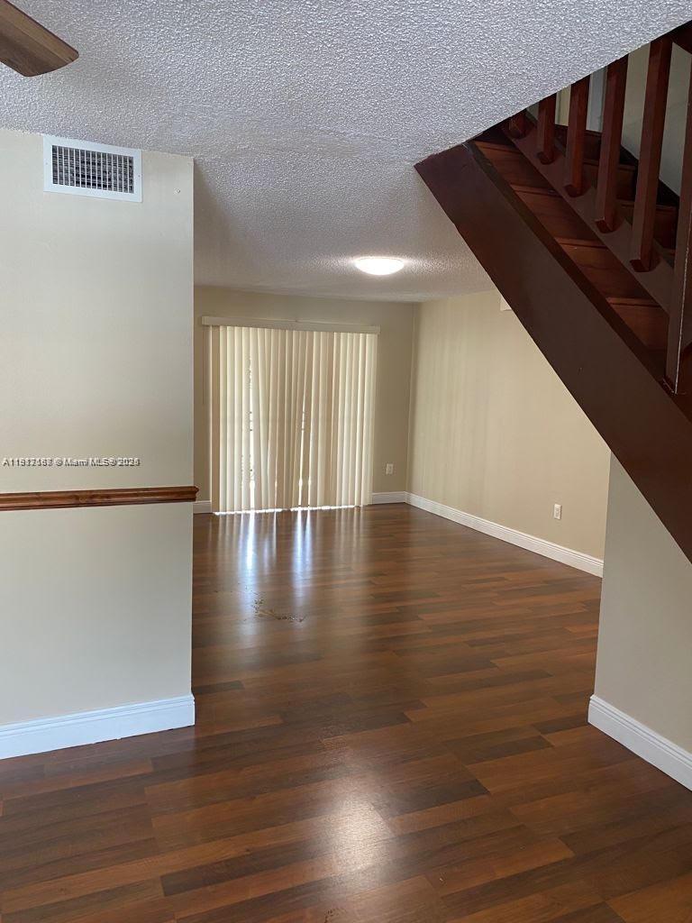 5306 West 26th Avenue, Unit 102 Hialeah, FL 33016 - Photo 31 of 33 a view of a room with wooden floor