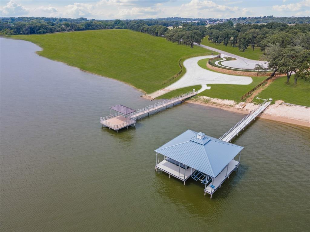 an aerial view of a house with a lake view