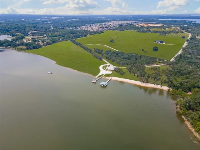 a view of a swimming pool with a lake view and mountain view