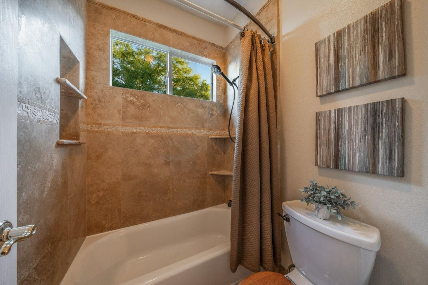 1486 Bay Tree Drive Gilroy, CA 95020 - Photo 19 of 26 a bathroom with a bathtub shower and toilet