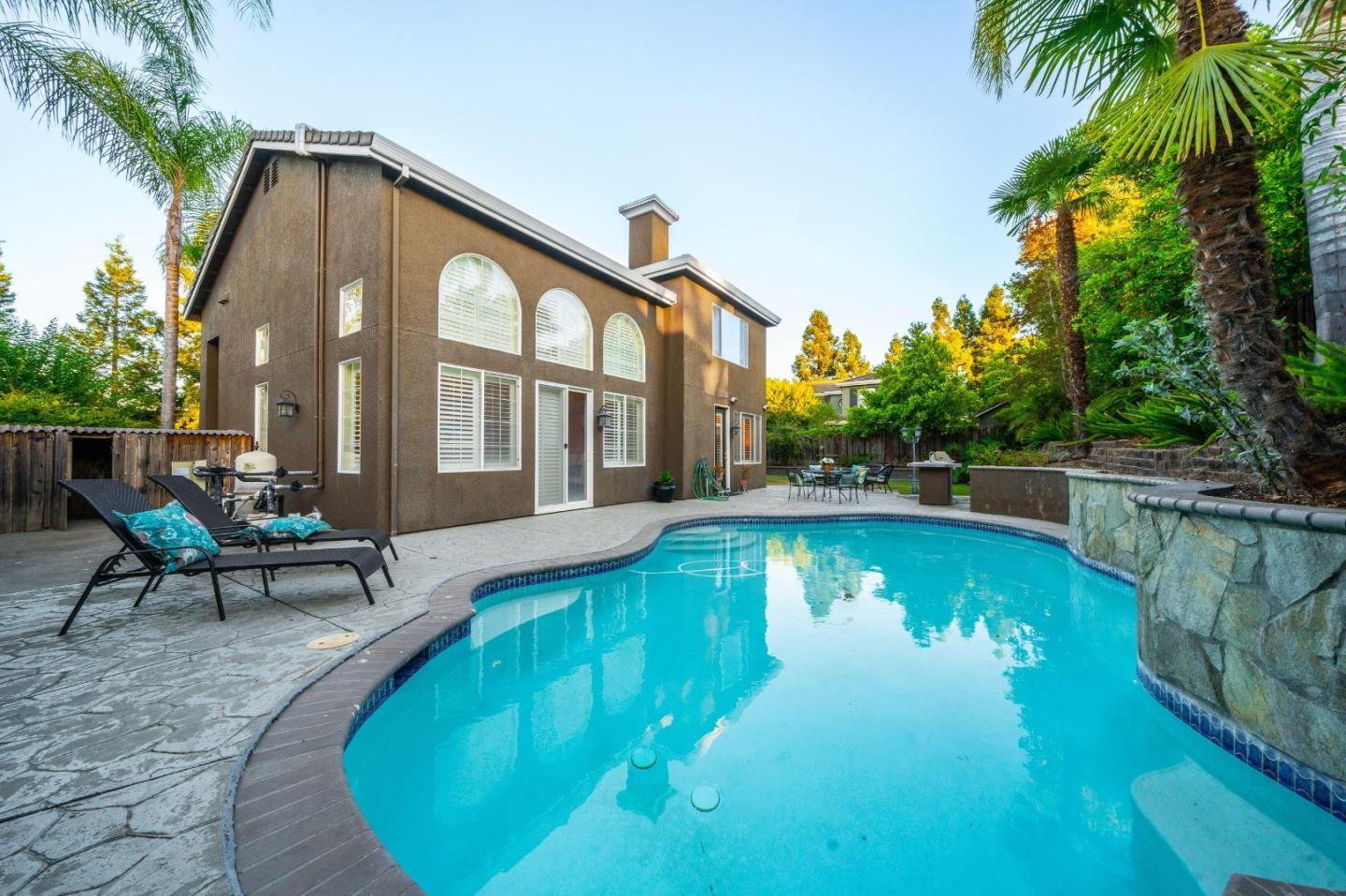 1486 Bay Tree Drive Gilroy, CA 95020 - Photo 20 of 26 a view of a house with swimming pool and sitting area