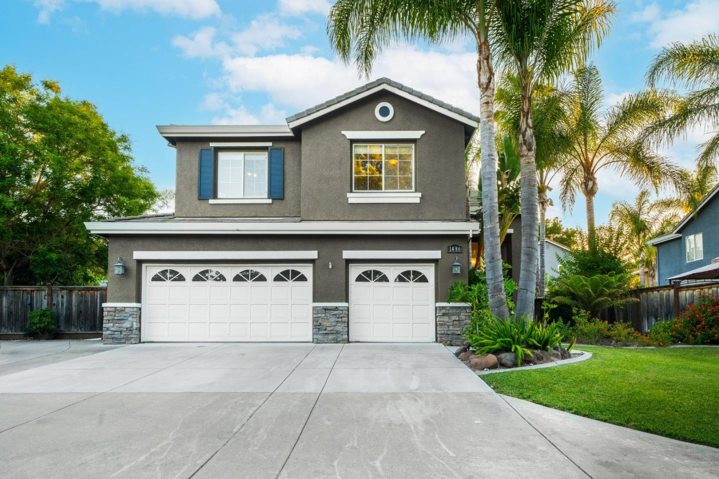 1486 Bay Tree Drive Gilroy, CA 95020 - Photo 2 of 26 a front view of a house with a yard and garage