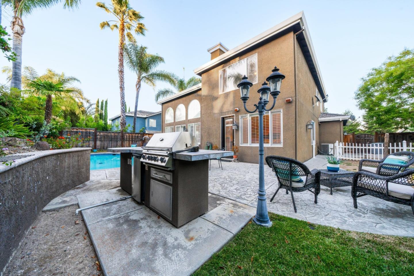1486 Bay Tree Drive Gilroy, CA 95020 - Photo 21 of 26 a view of a house with backyard and sitting area