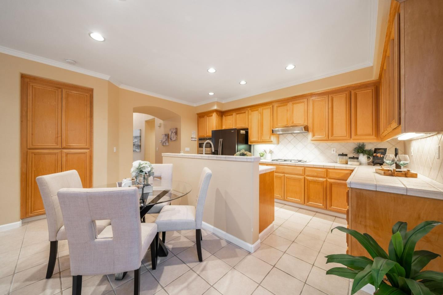 1486 Bay Tree Drive Gilroy, CA 95020 - Photo 8 of 26 a view of kitchen with granite countertop cabinets table and chairs