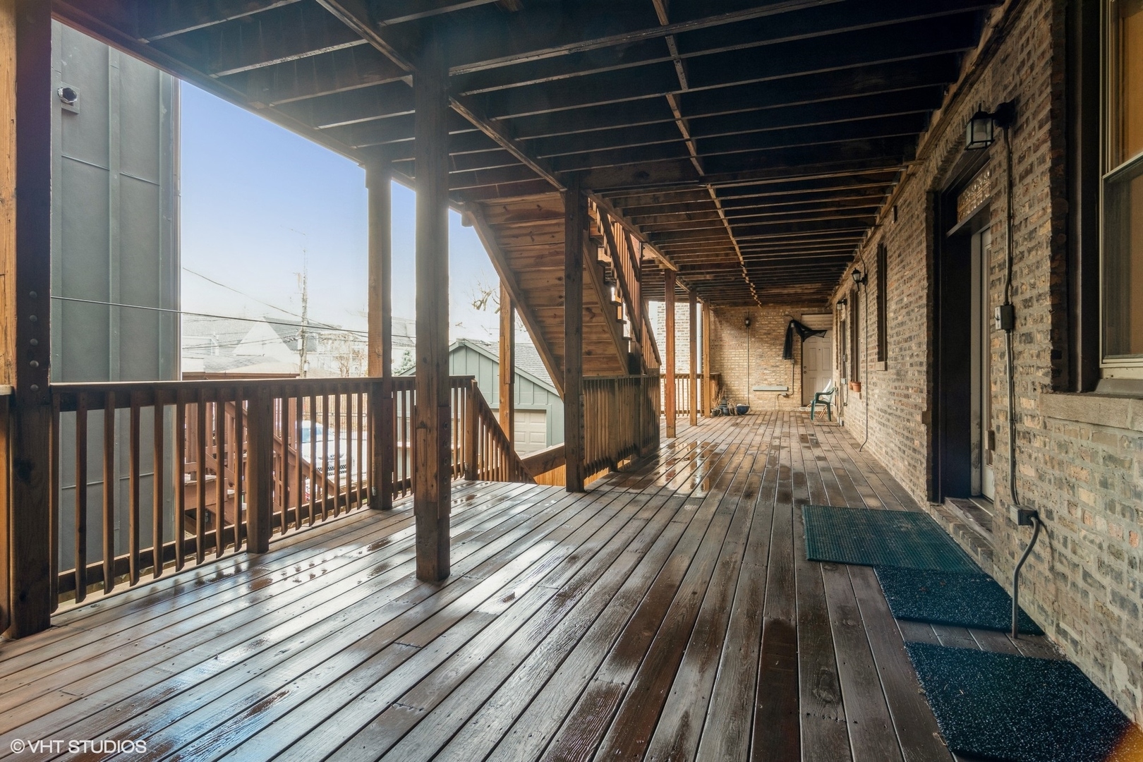 3105 West George Street, Unit 1 Chicago, IL 60618 - Photo 11 of 11 a view of a porch with wooden floor