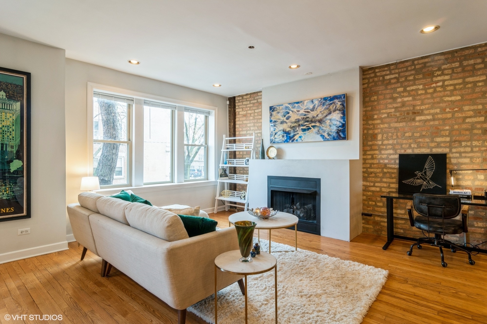 3105 West George Street, Unit 1 Chicago, IL 60618 - Photo 2 of 11 a living room with furniture and a fireplace