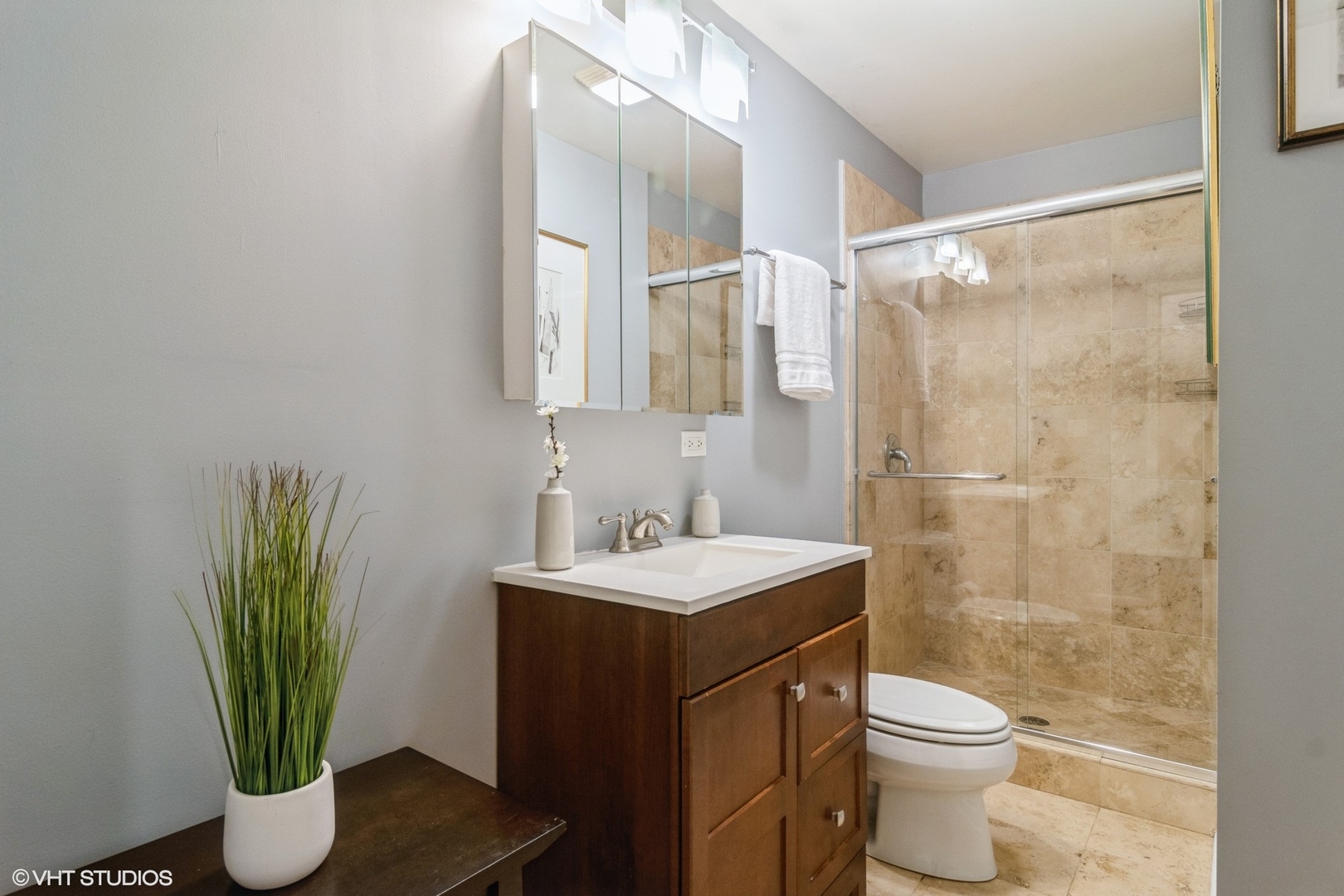 3105 West George Street, Unit 1 Chicago, IL 60618 - Photo 10 of 11 a bathroom with a sink toilet and a mirror
