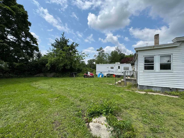 a view of a back yard of the house