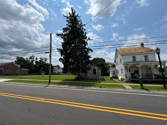 a view of a cars park in front of a building