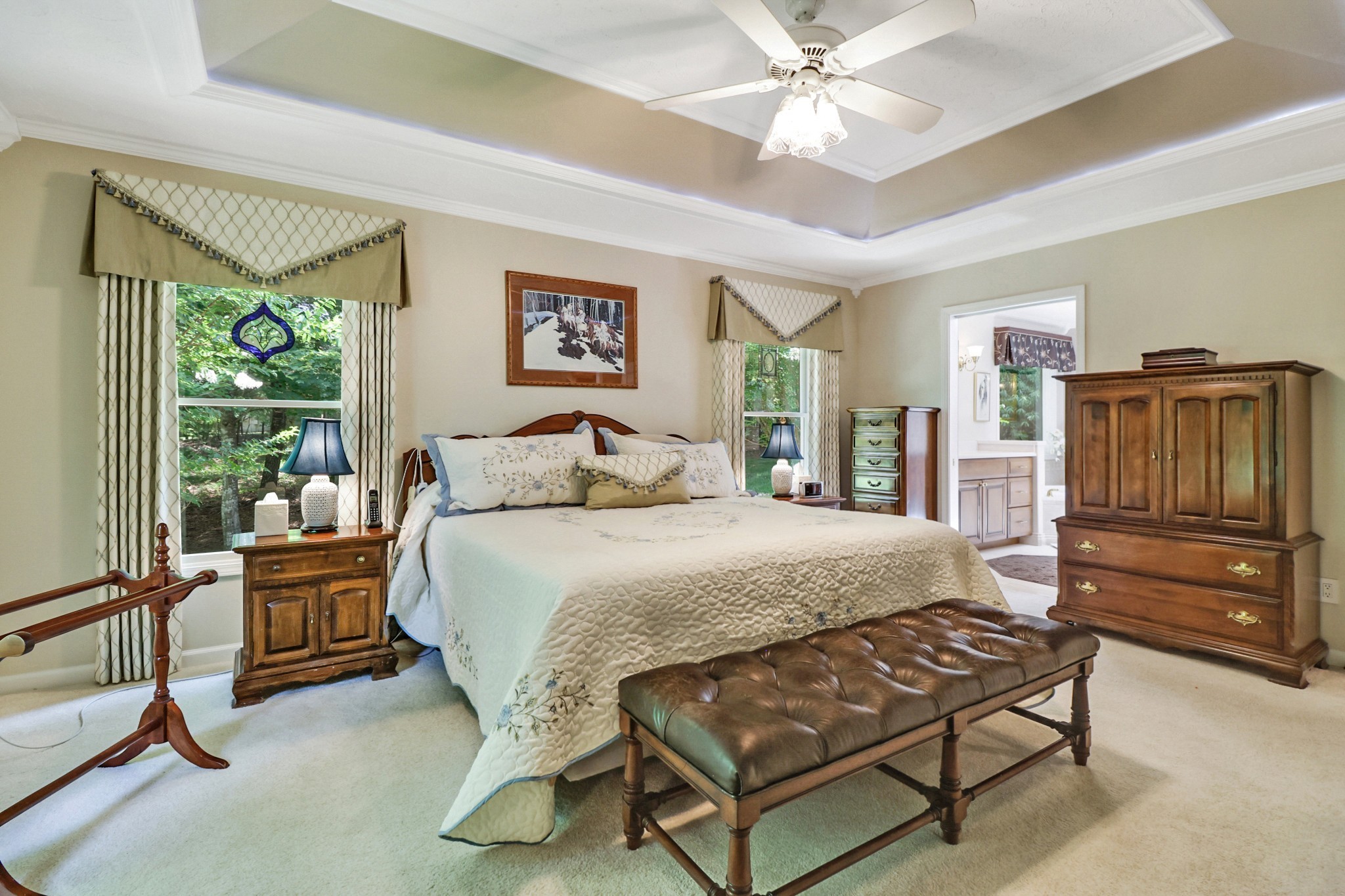 44 Inwood Court Crossville, TN 38558 - Photo 18 of 54 a bedroom with a bed and a chandelier