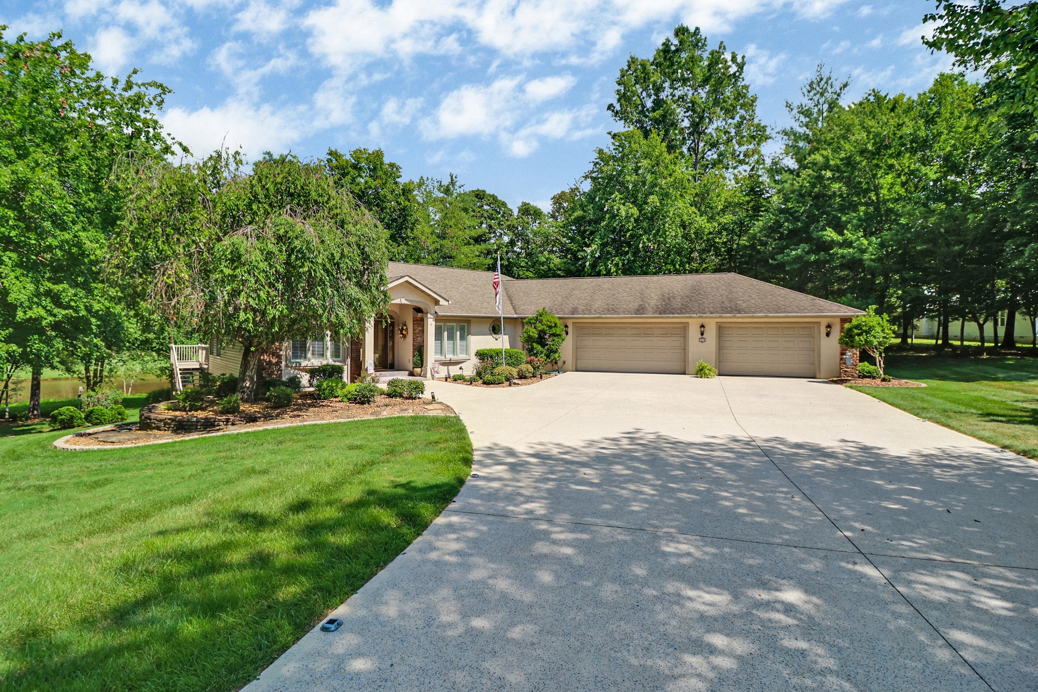 44 Inwood Court Crossville, TN 38558 - Photo 2 of 54 a house view with a garden space