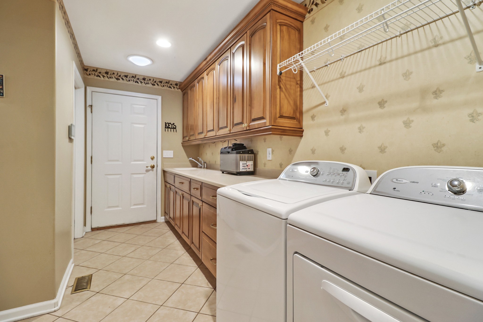 44 Inwood Court Crossville, TN 38558 - Photo 31 of 54 a view of washer and dryer with bathroom in the background