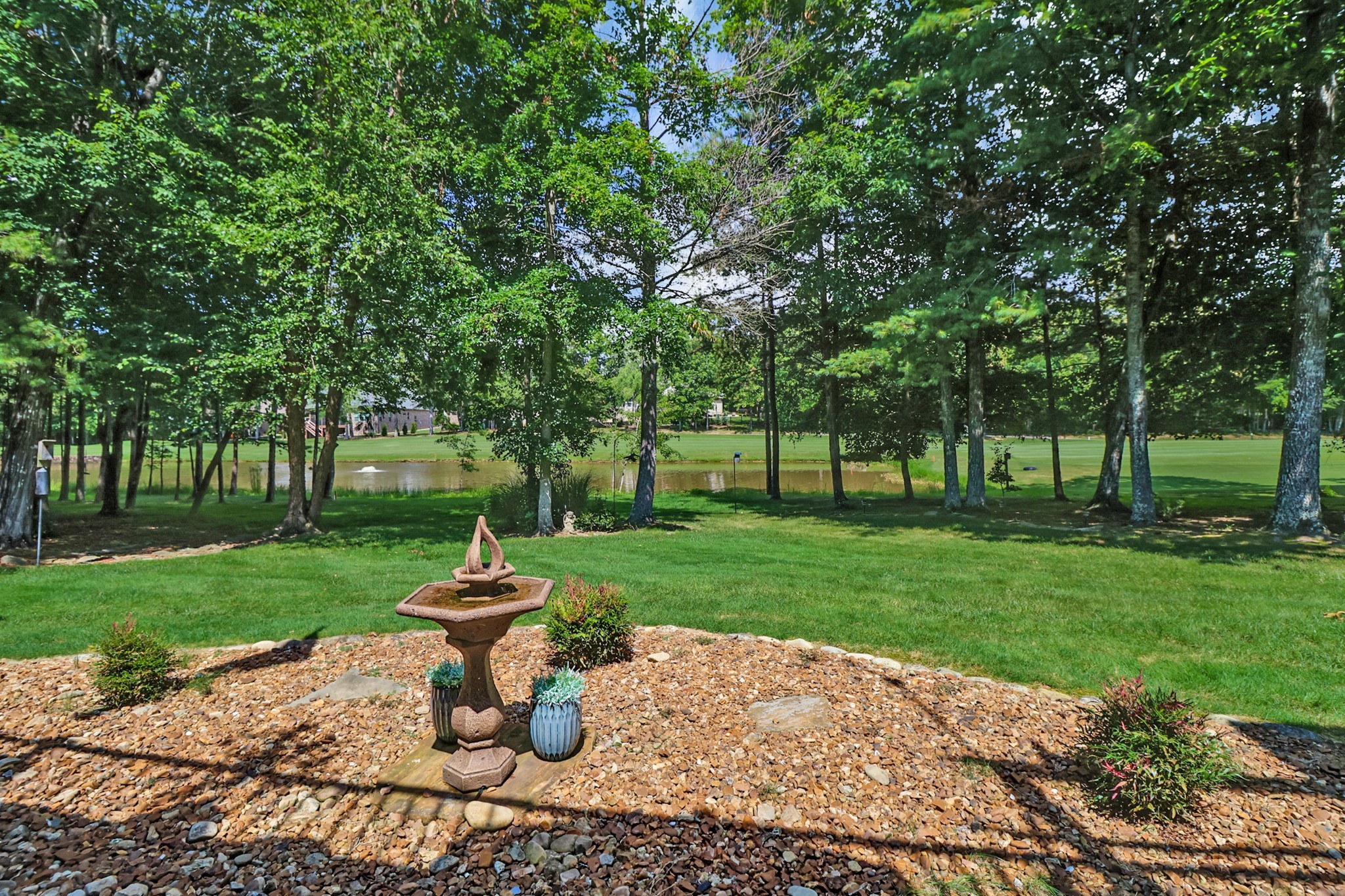 44 Inwood Court Crossville, TN 38558 - Photo 47 of 54 a wooden bench sitting in a grassy field