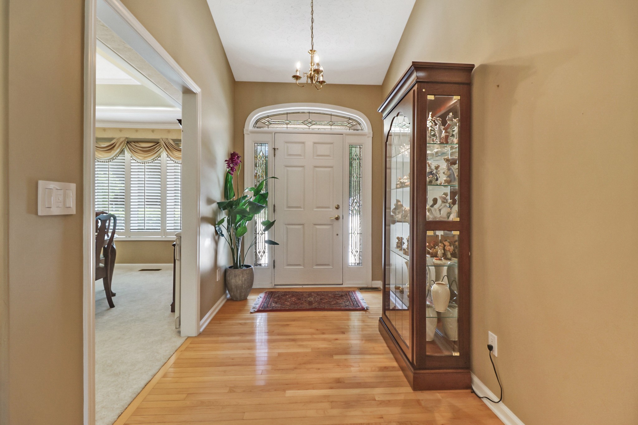 44 Inwood Court Crossville, TN 38558 - Photo 5 of 54 a view of a hallway with wooden floor and a dining room