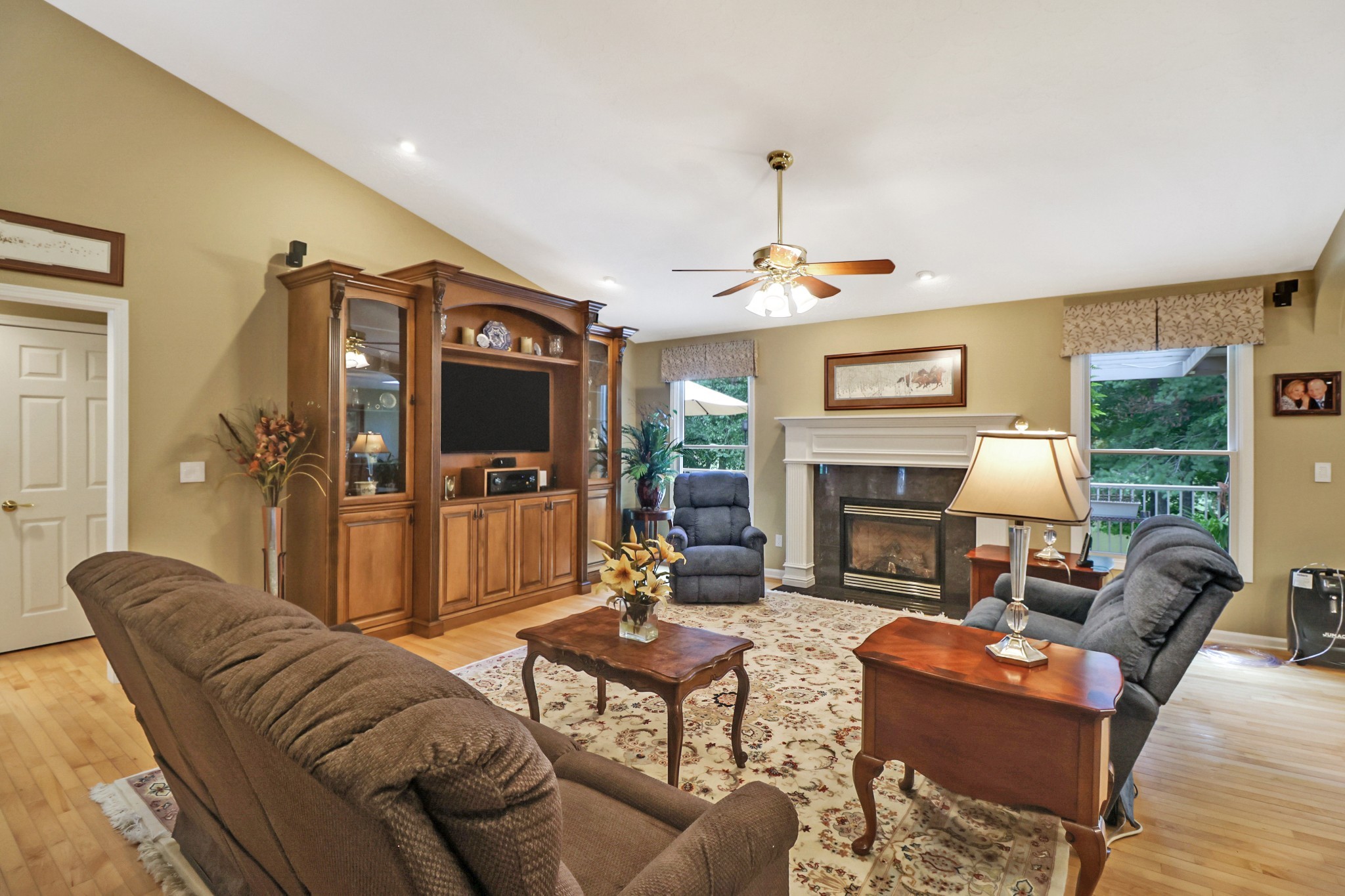44 Inwood Court Crossville, TN 38558 - Photo 10 of 54 a living room with furniture a fireplace and a flat screen tv