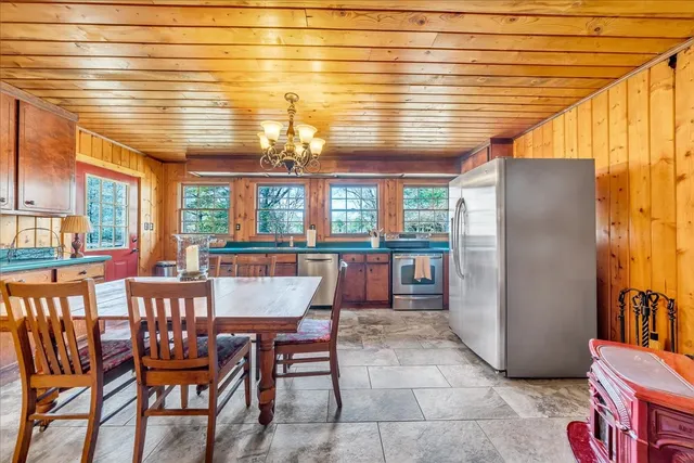 a bathroom with a granite countertop sink mirror vanity and a toilet