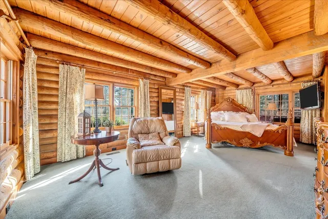 a view of house with wooden floor and outdoor seating