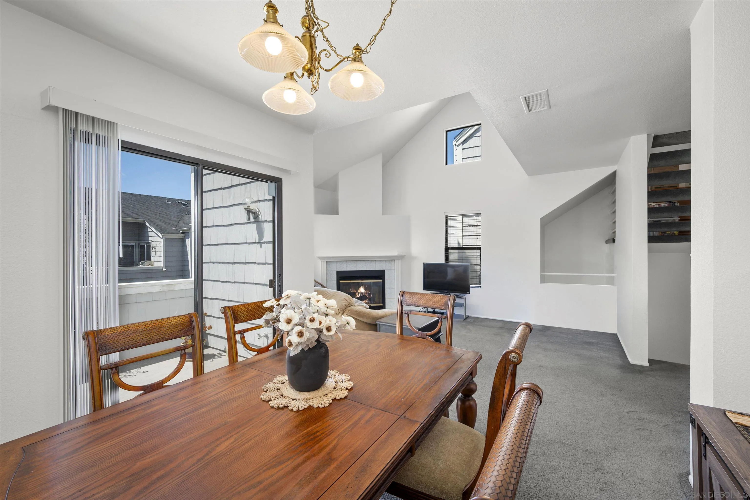11061 Scripps Ranch Boulevard San Diego, CA 92131 - Photo 13 of 66 a view of a dining room with furniture wooden floor and a chandelier