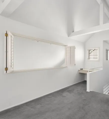a bathroom with double vanity sinks and a mirror