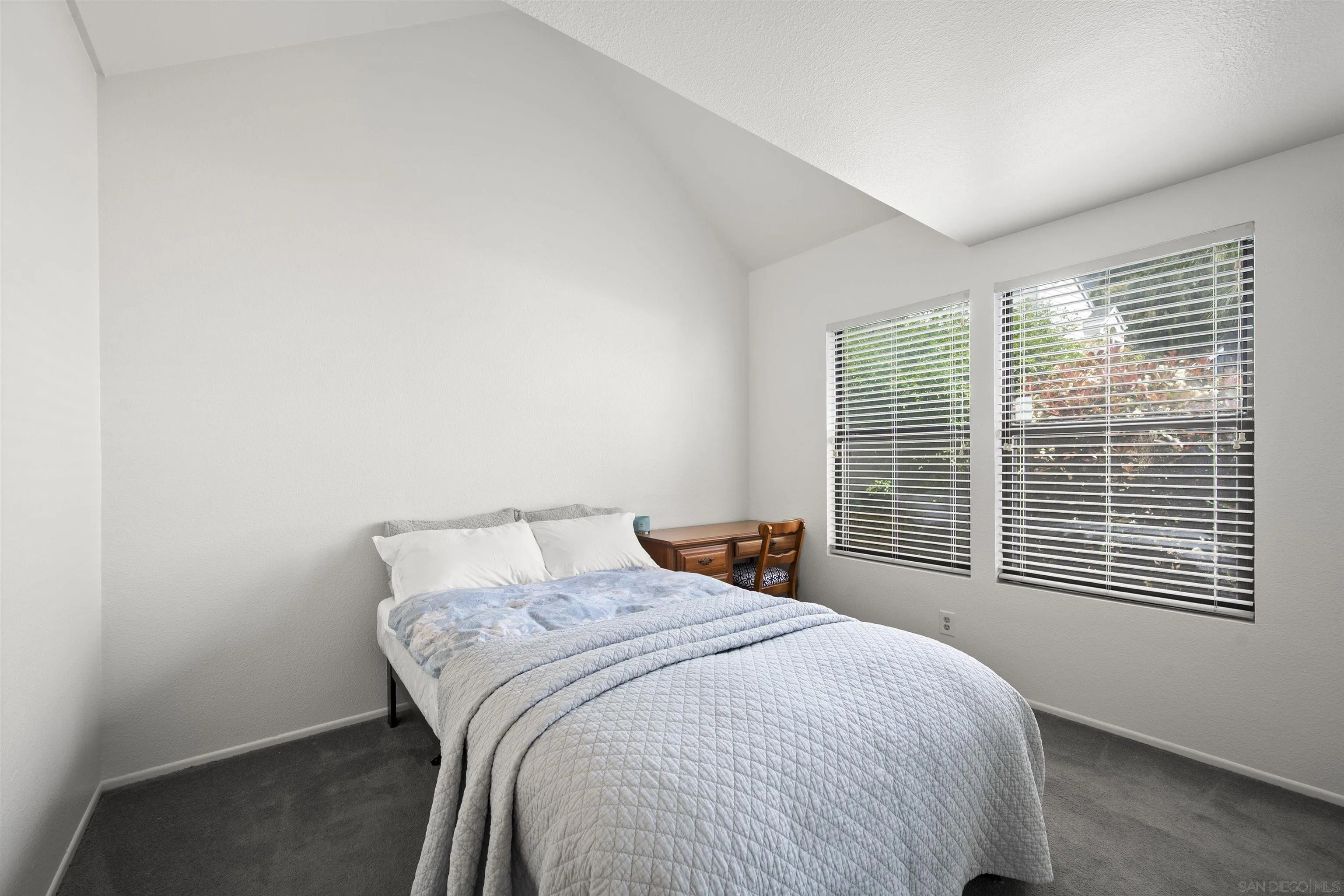 11061 Scripps Ranch Boulevard San Diego, CA 92131 - Photo 21 of 66 a bedroom with a bed and a window