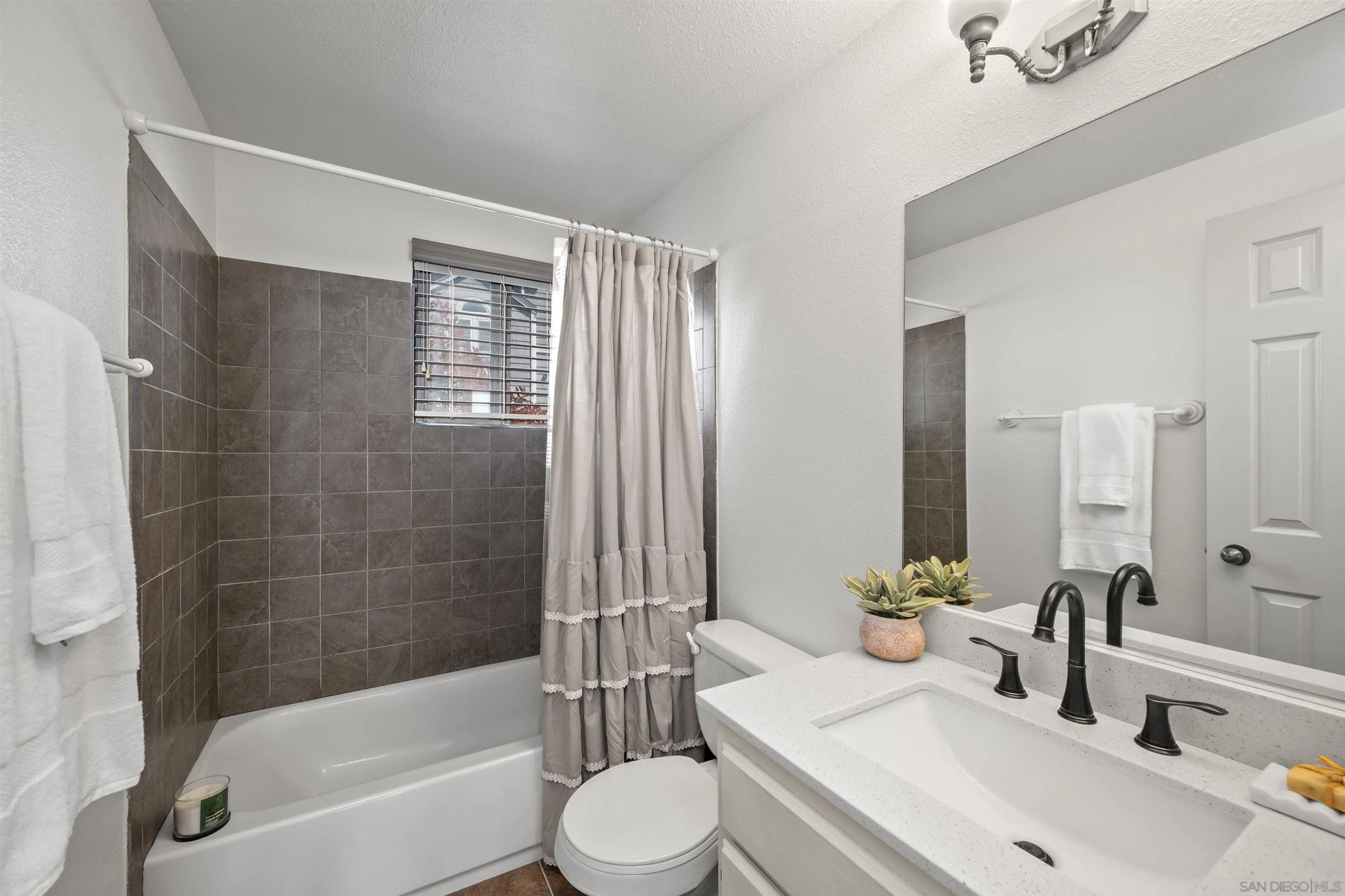 11061 Scripps Ranch Boulevard San Diego, CA 92131 - Photo 23 of 66 a bathroom with a sink toilet and shower