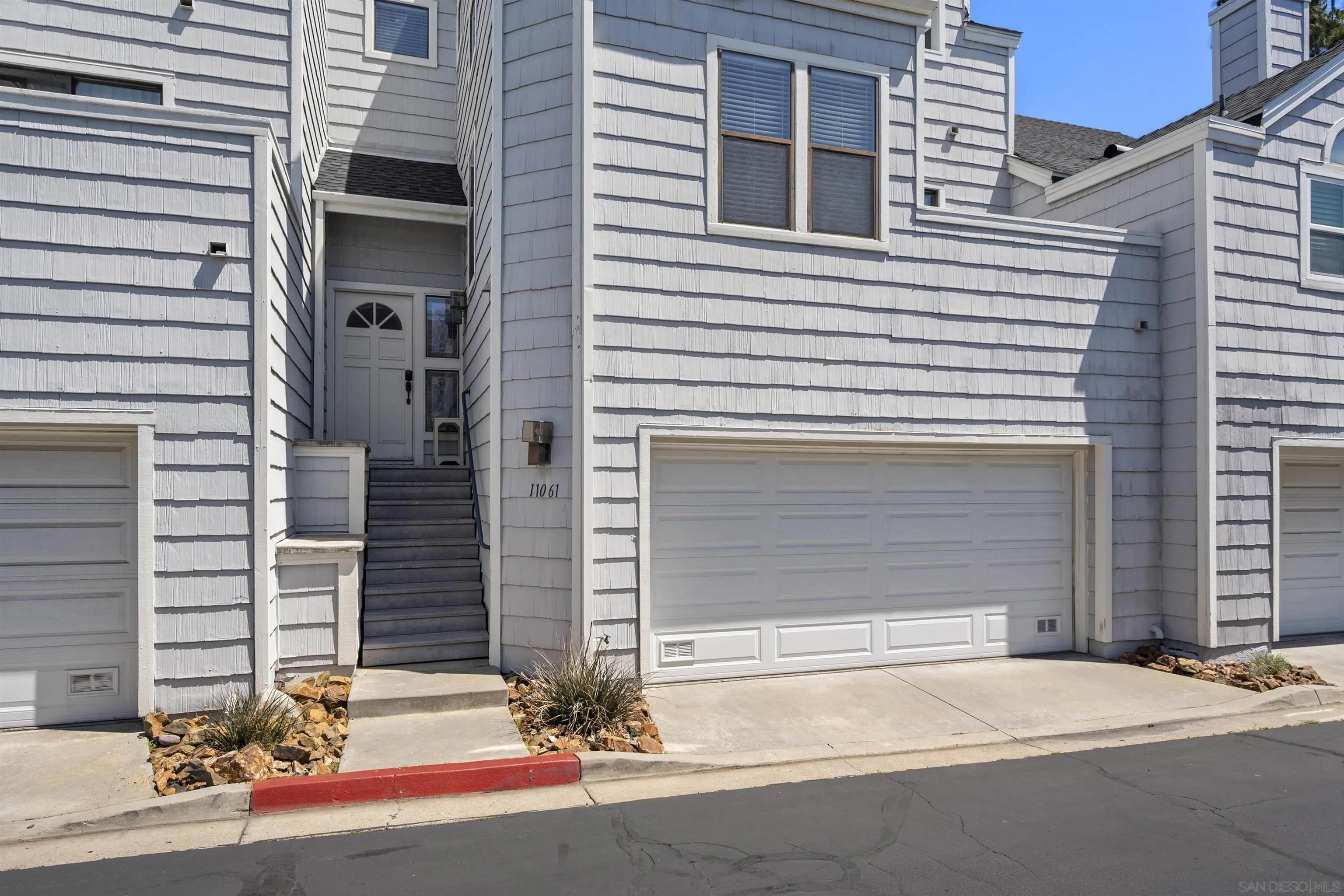 11061 Scripps Ranch Boulevard San Diego, CA 92131 - Photo 32 of 66 a front view of a house with a garage