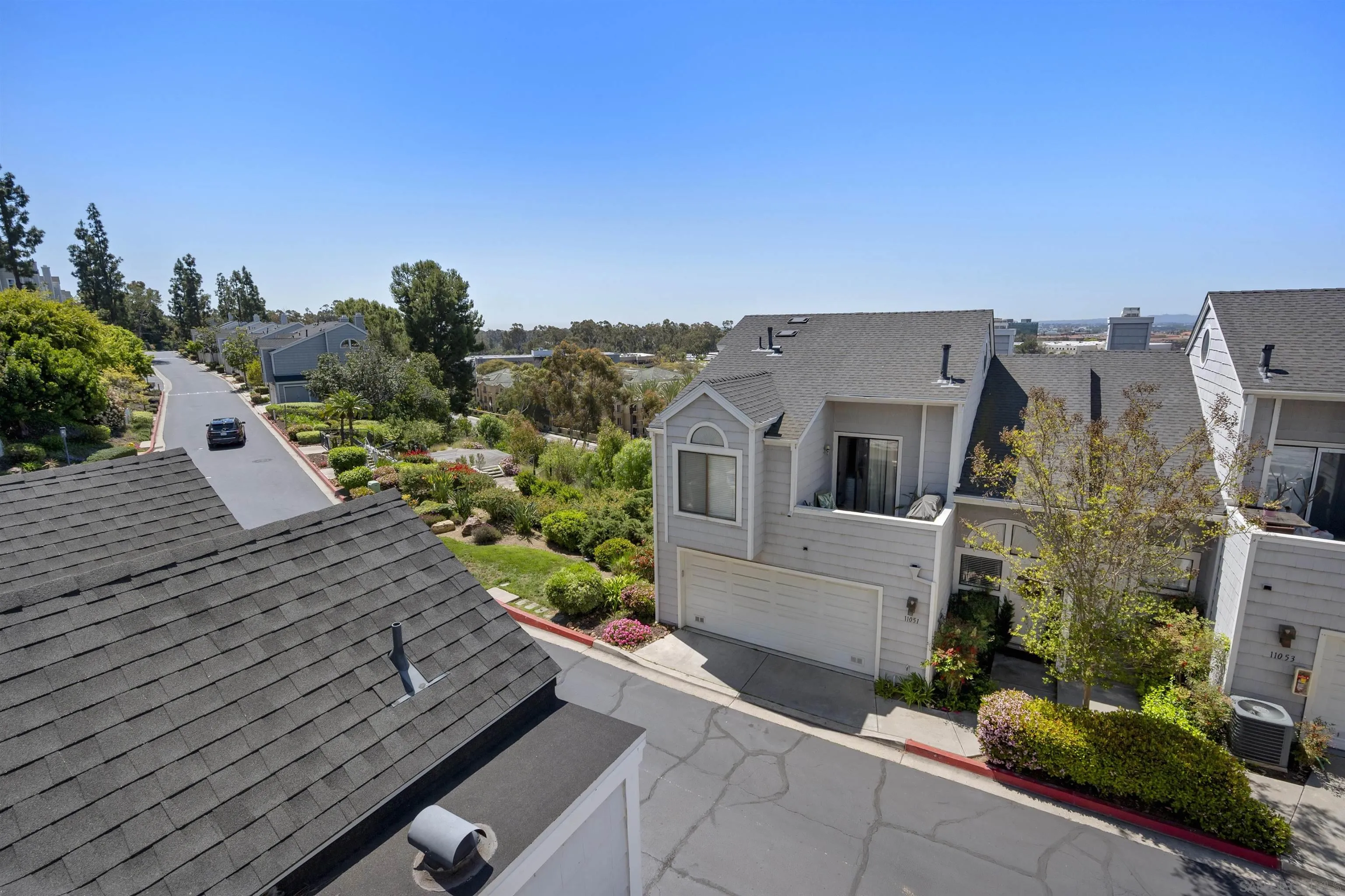 11061 Scripps Ranch Boulevard San Diego, CA 92131 - Photo 34 of 66 a view of a house with a yard