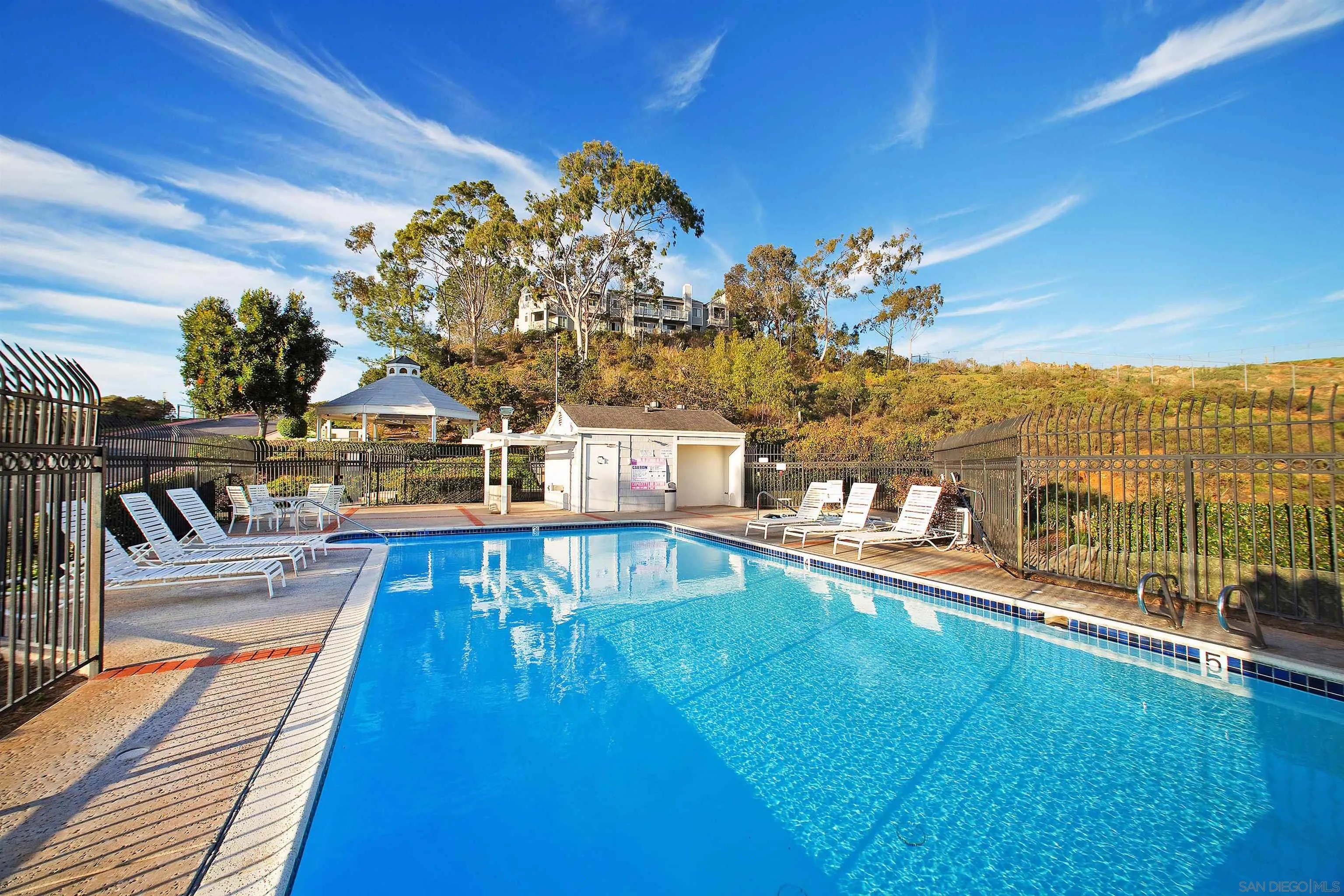 11061 Scripps Ranch Boulevard San Diego, CA 92131 - Photo 42 of 66 a view of a swimming pool with a lounge chair