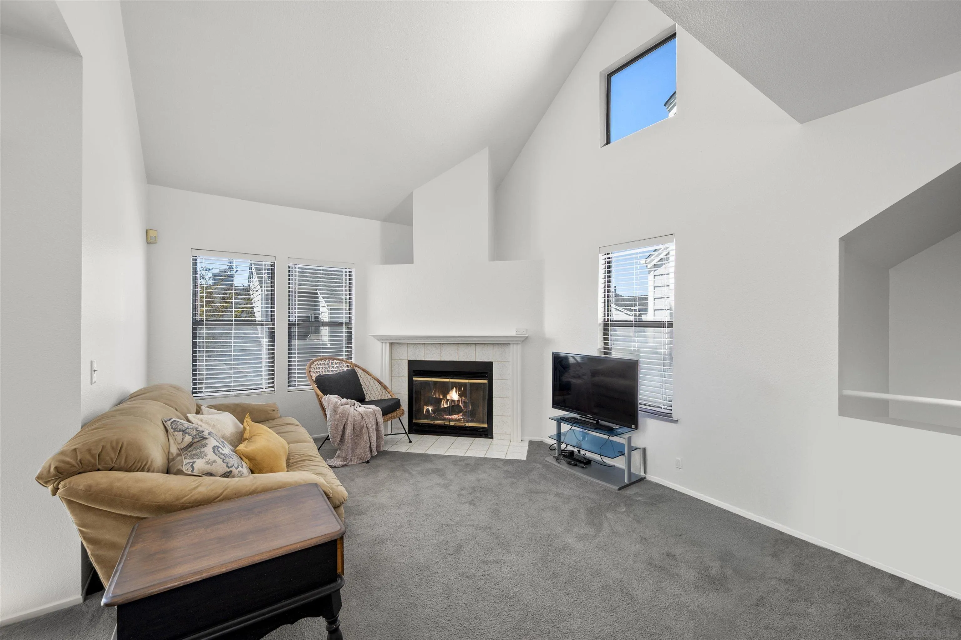 11061 Scripps Ranch Boulevard San Diego, CA 92131 - Photo 7 of 66 a living room with furniture a fireplace and a flat screen tv