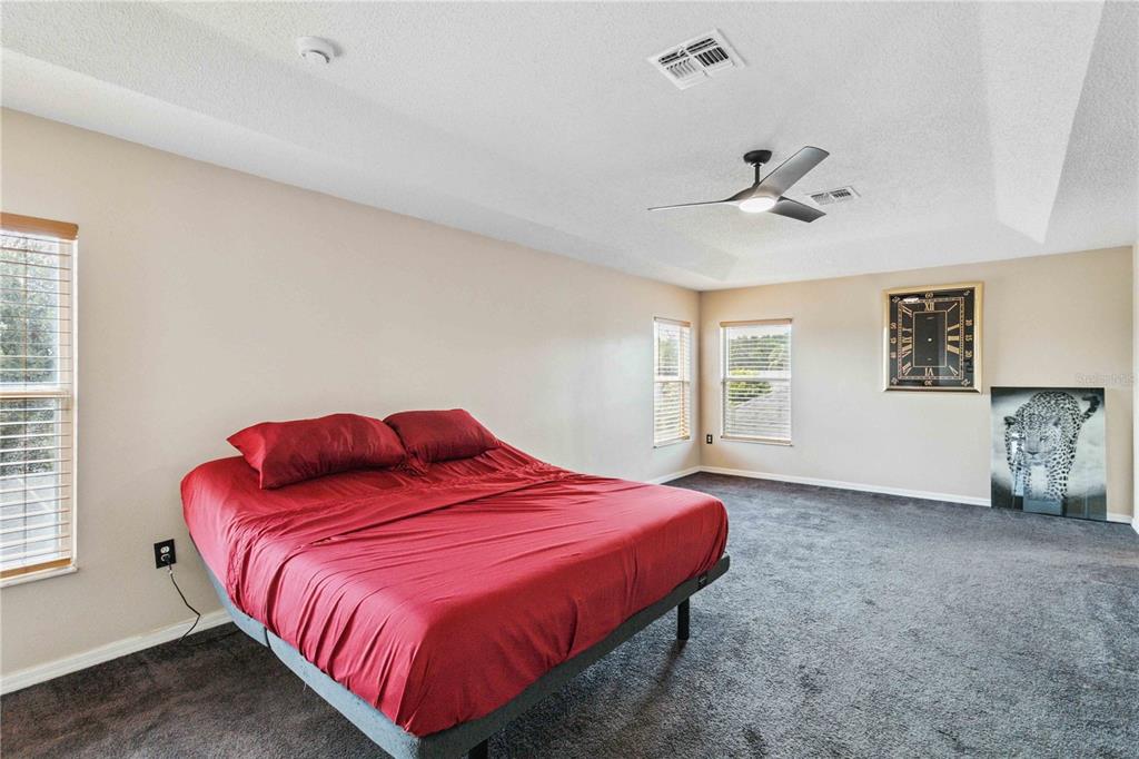 2881 Lyndscape Street Orlando, FL 32833 - Photo 12 of 30 a bedroom with a bed and a window