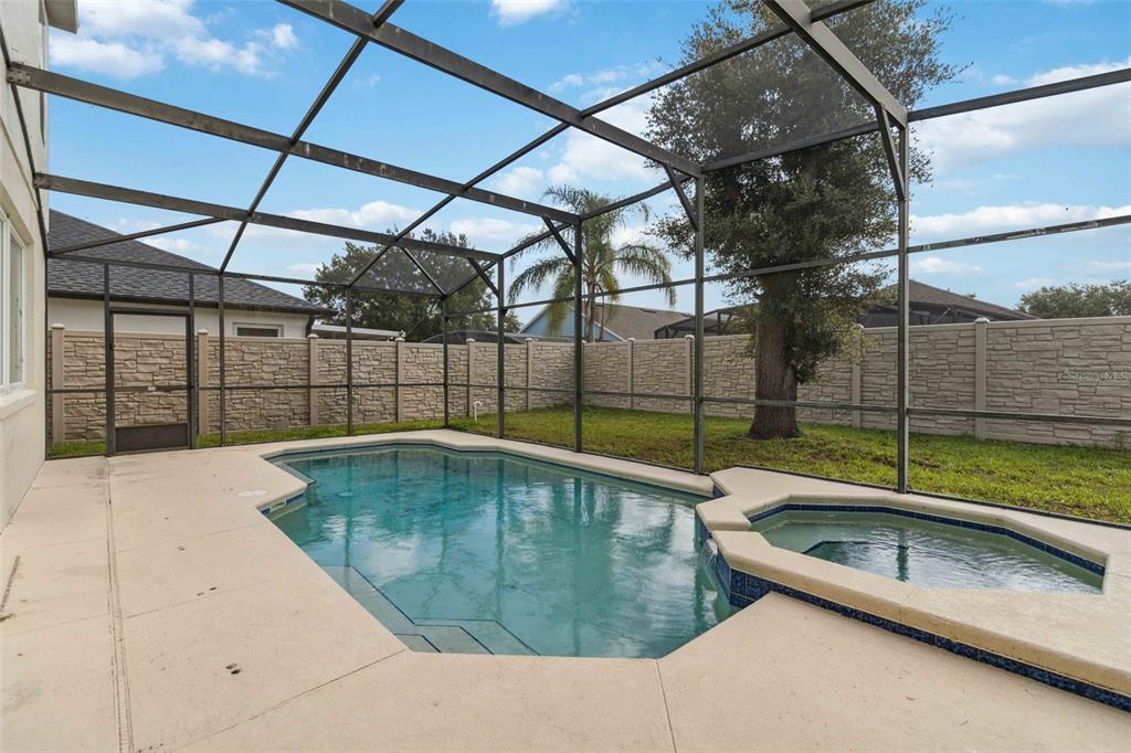 2881 Lyndscape Street Orlando, FL 32833 - Photo 2 of 30 a swimming pool with a outdoor seating