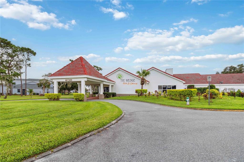 2881 Lyndscape Street Orlando, FL 32833 - Photo 26 of 30 a front view of a house with a yard table and chairs
