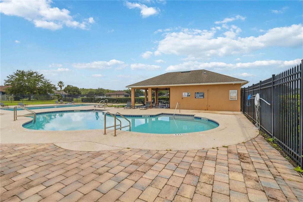 2881 Lyndscape Street Orlando, FL 32833 - Photo 28 of 30 a view of a lake with a terrace
