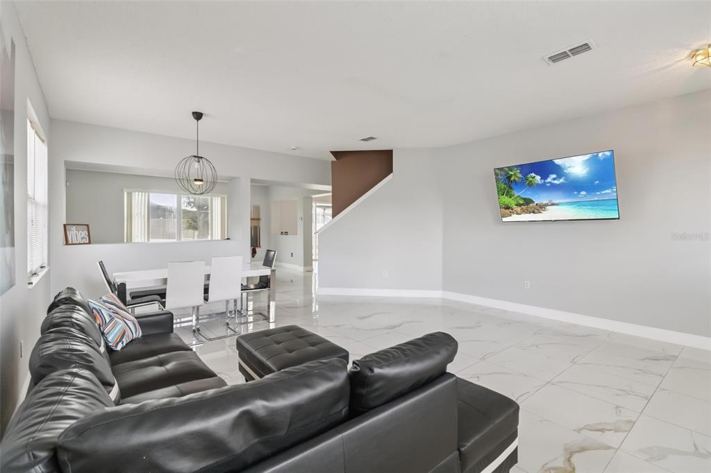 2881 Lyndscape Street Orlando, FL 32833 - Photo 4 of 30 a living room with furniture