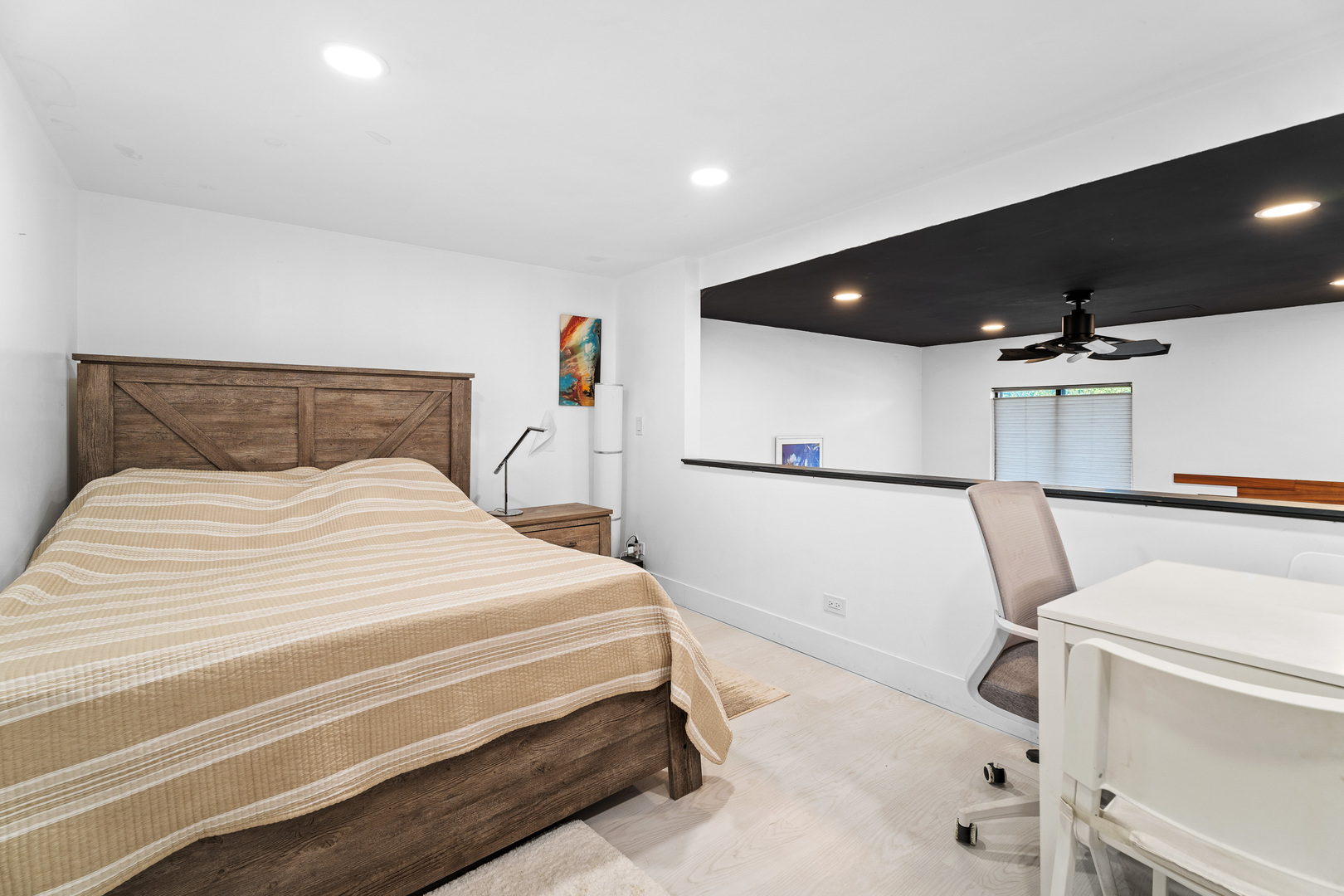 40 North Tower Road, Unit 1E Oak Brook, IL 60523 - Photo 11 of 16 a bedroom with a white bed and a flat screen tv