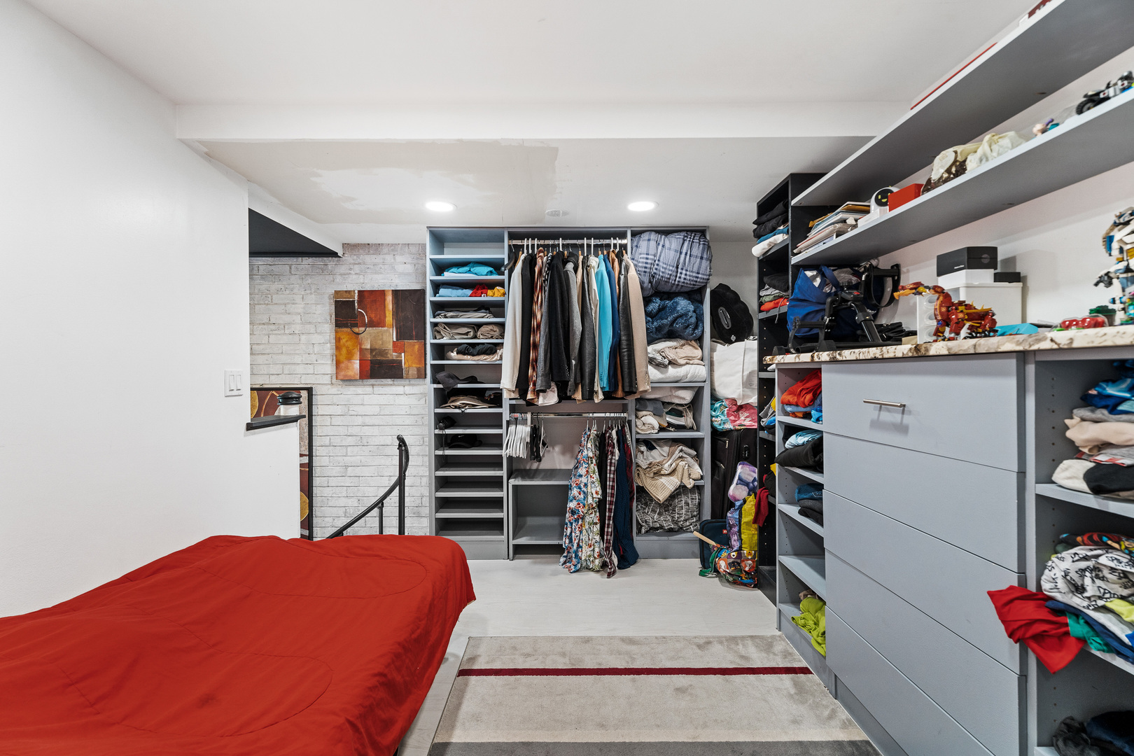 40 North Tower Road, Unit 1E Oak Brook, IL 60523 - Photo 14 of 16 a view of walk in closet with clothes and shoes