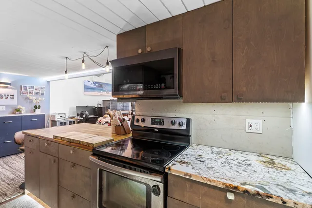 a kitchen with a stove and a microwave