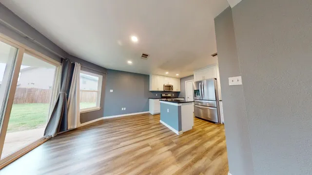 a view of kitchen and wooden floor