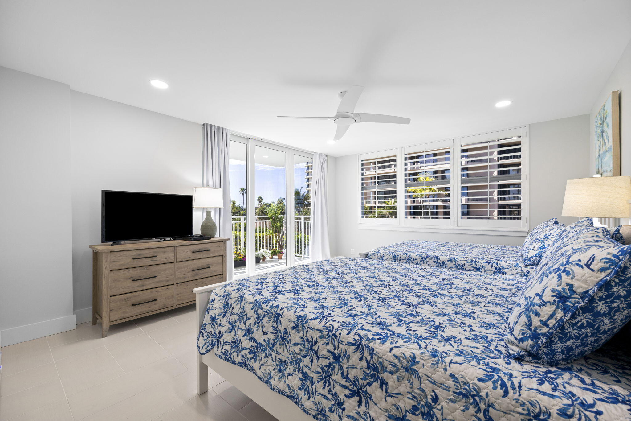 500 Ocean Drive, Unit E3A Juno Beach, FL 33408 - Photo 13 of 28 a spacious bedroom with a bed and flat screen tv