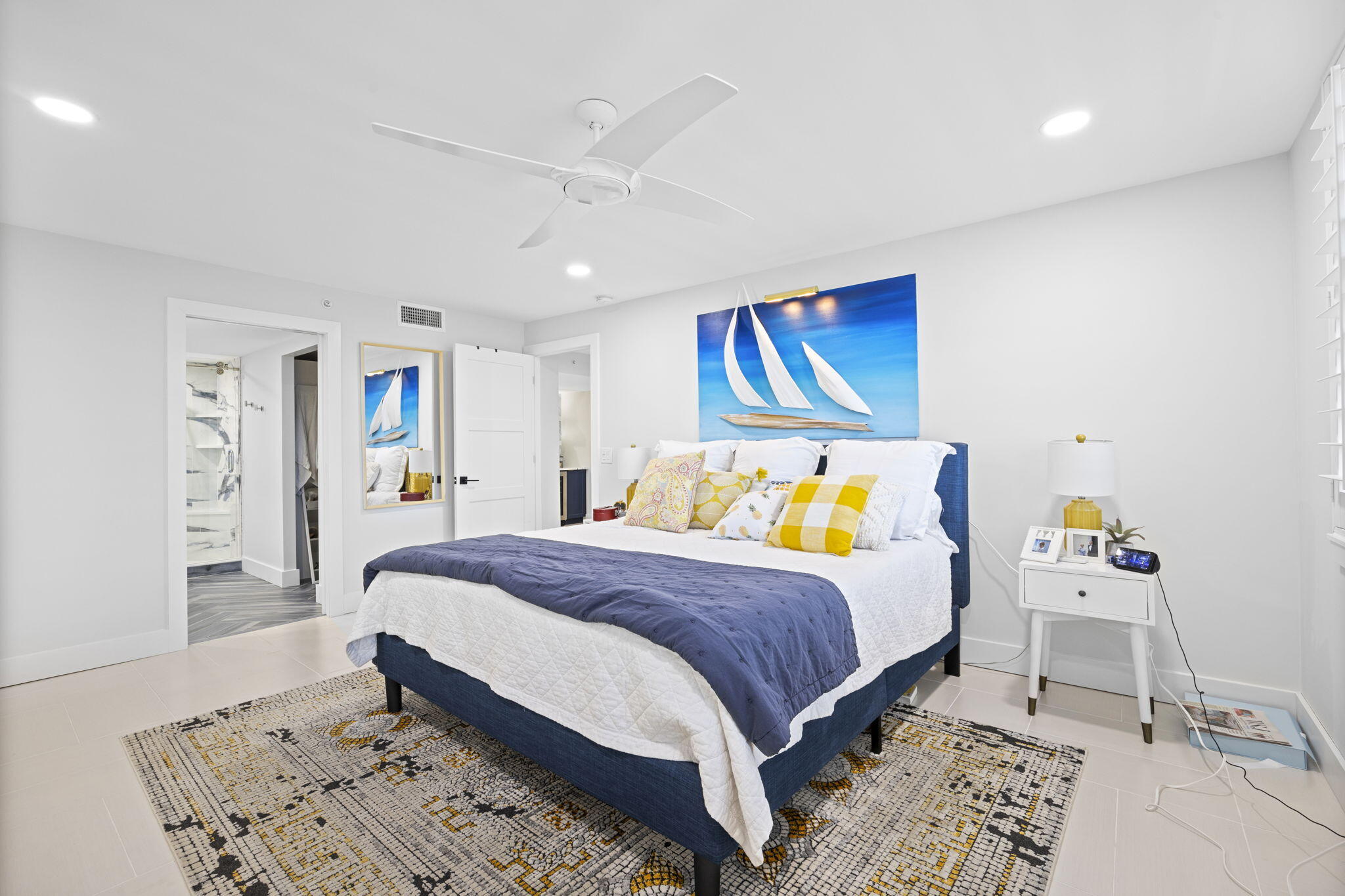 500 Ocean Drive, Unit E3A Juno Beach, FL 33408 - Photo 21 of 28 a bedroom with a bed and a dresser