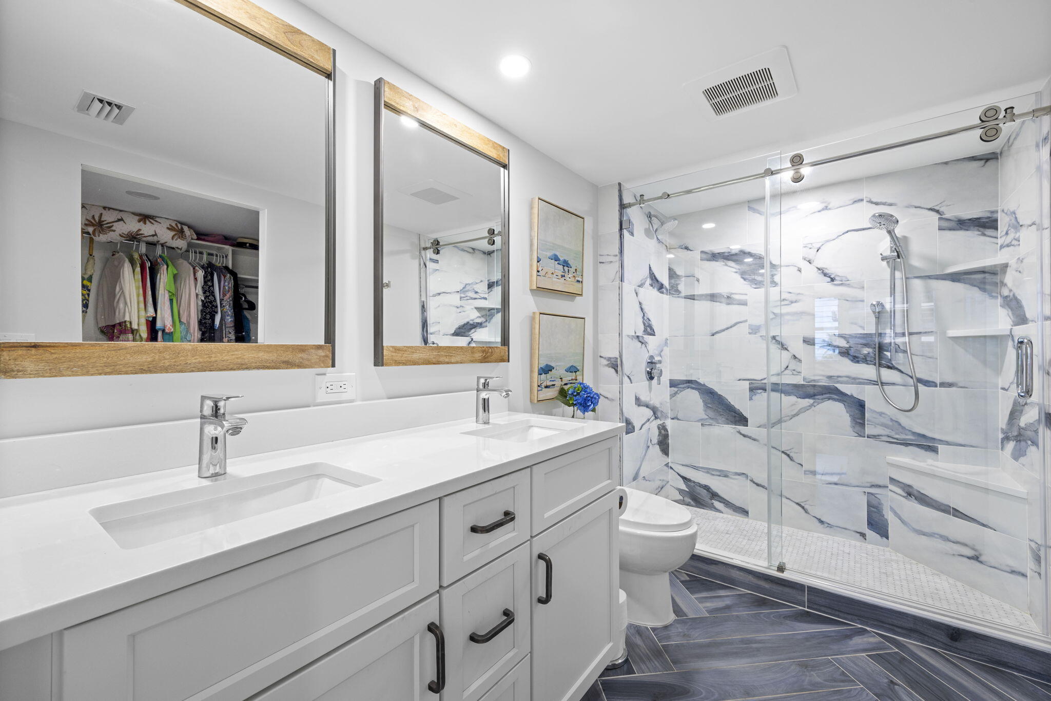 500 Ocean Drive, Unit E3A Juno Beach, FL 33408 - Photo 22 of 28 a bathroom with a double vanity sink mirror and toilet