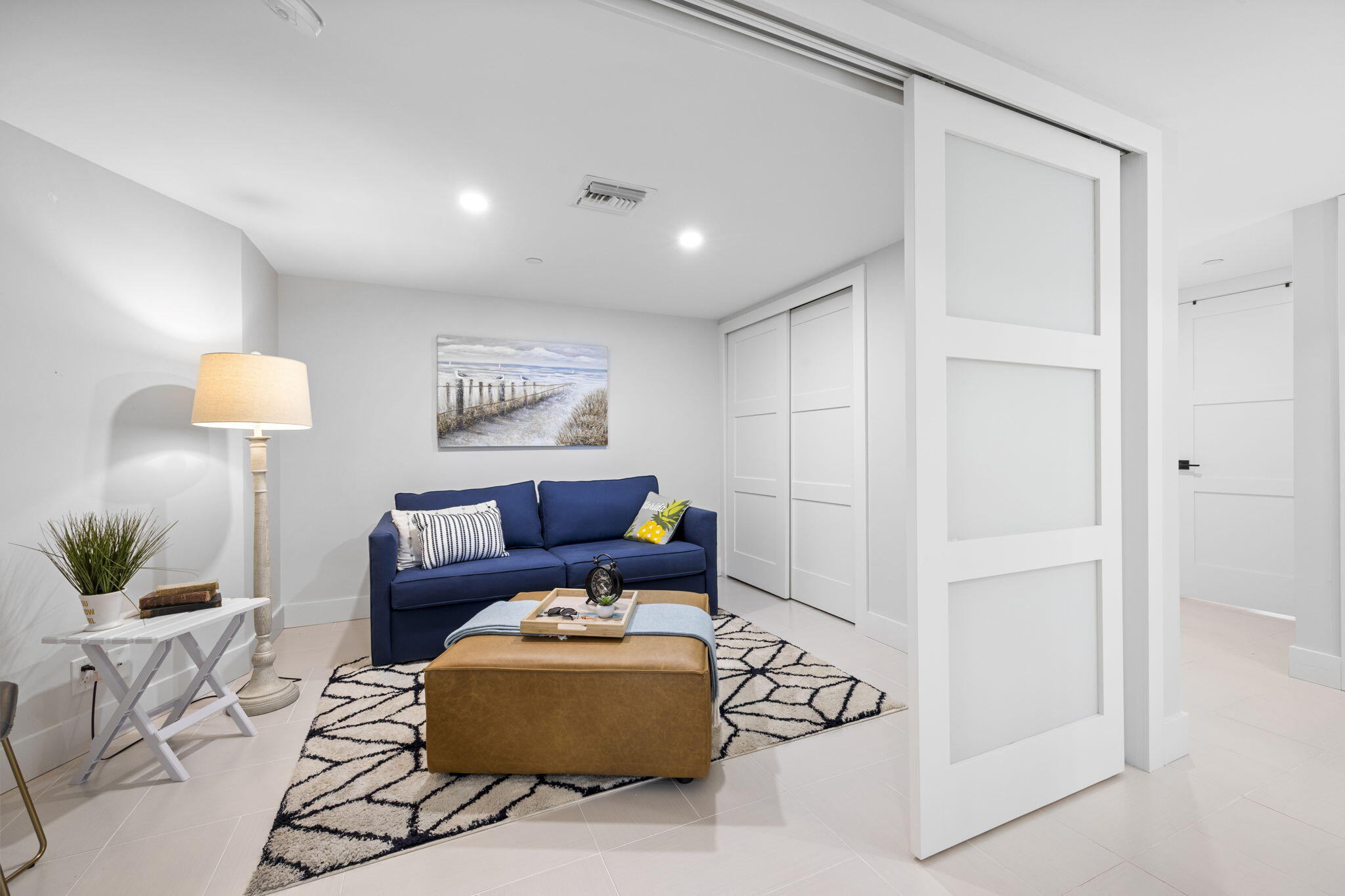 500 Ocean Drive, Unit E3A Juno Beach, FL 33408 - Photo 3 of 28 a living room with furniture and a lamp