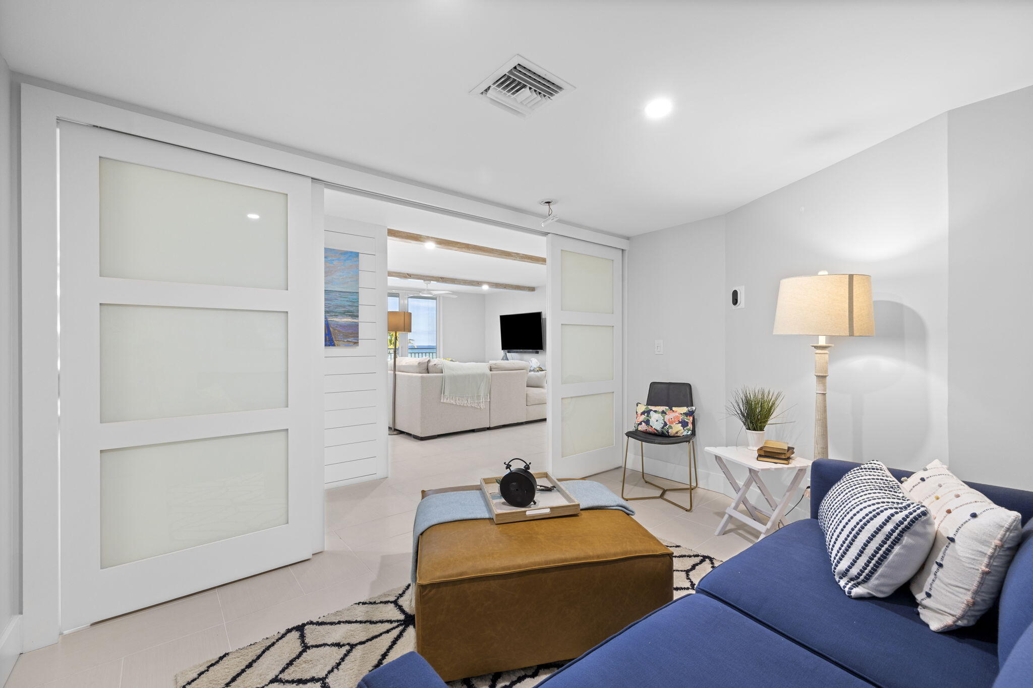 500 Ocean Drive, Unit E3A Juno Beach, FL 33408 - Photo 4 of 28 a bedroom with furniture and a wooden floor